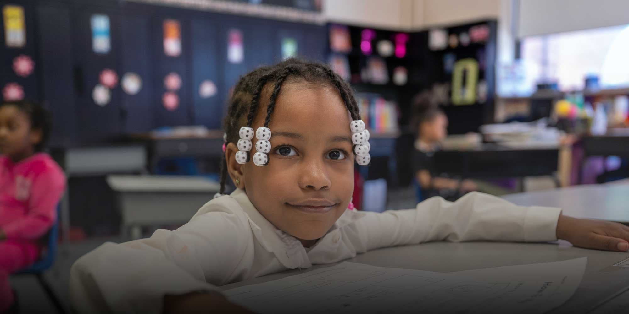 Elementary student sitting in class