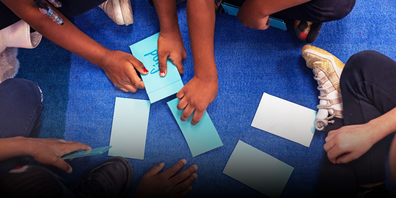 Students playing card game
